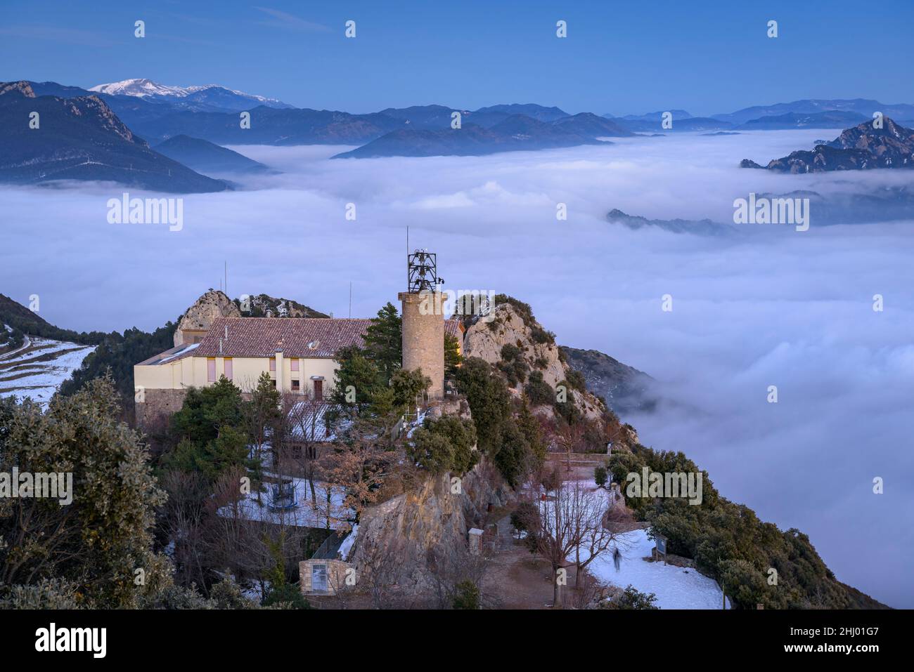 Queralt Sanctuary in a winter sunset with a sea of clouds over Berga (Berguedà, Catalonia, Spain, Pyrenees) ESP: Santuario de Queralt al atardecer Stock Photo