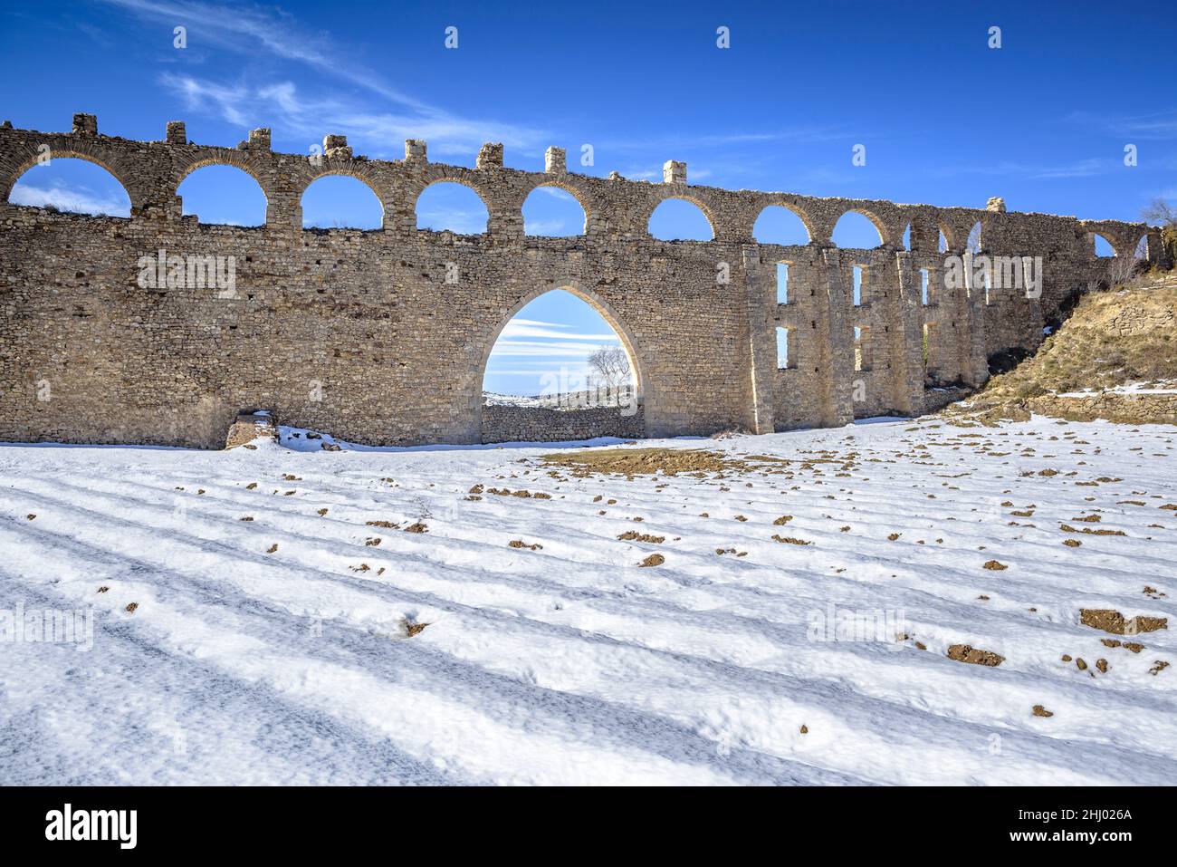 Morella aqueduct after a snowfall in winter (Castellón province, Valencian Community, Spain) ESP: Acueducto de Morella tras una nevada, Com Valenciana Stock Photo