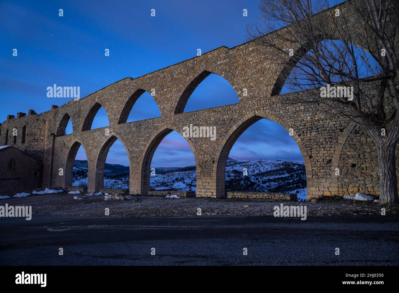 Morella aqueduct in the early morning and blue hour (Castellón province, Valencian Community, Spain) ESP: Acueducto de Morella en hora azul (Valencia) Stock Photo