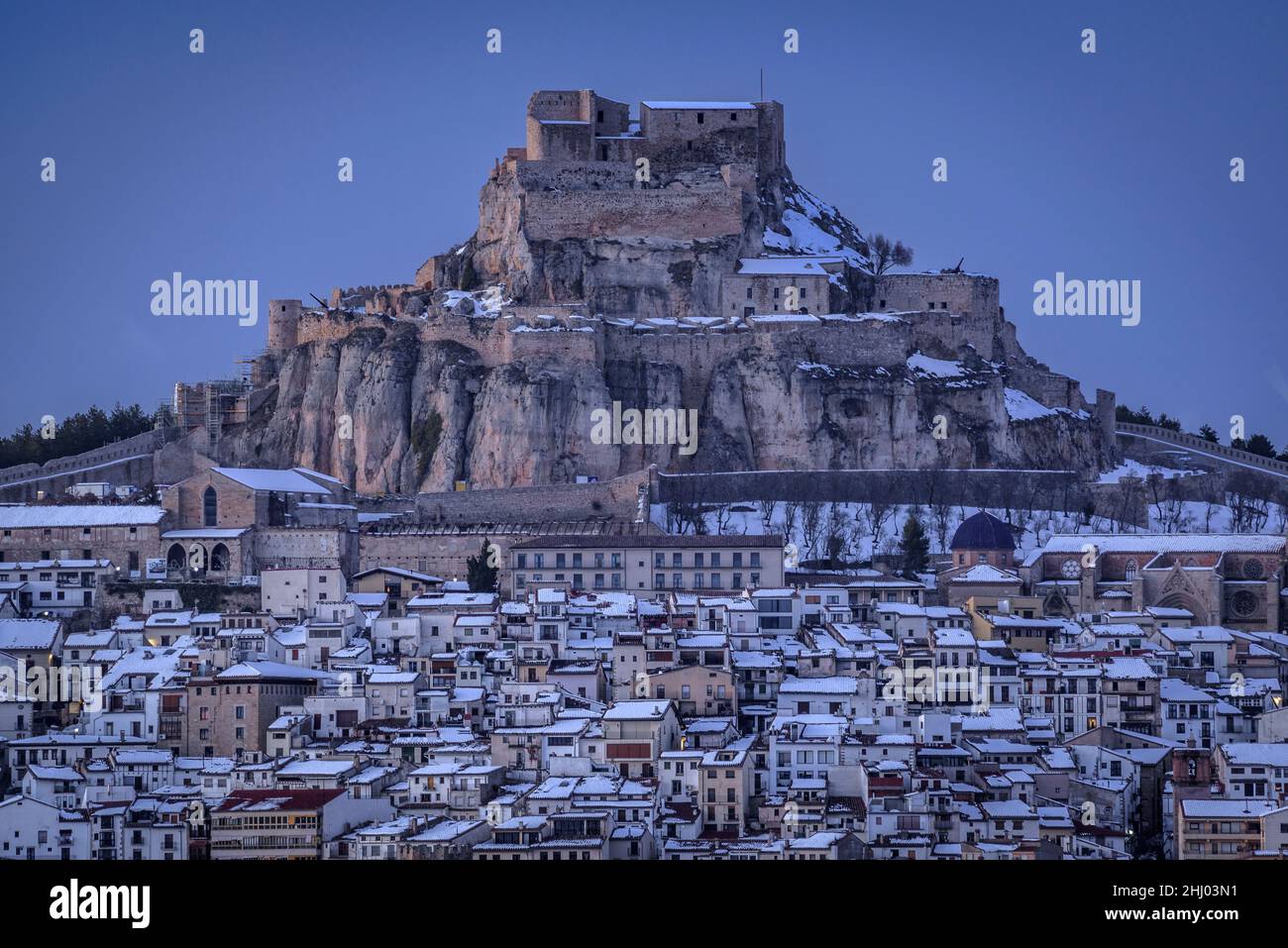 Morella medieval castle in a winter sunset, after a snowfall (Castellón