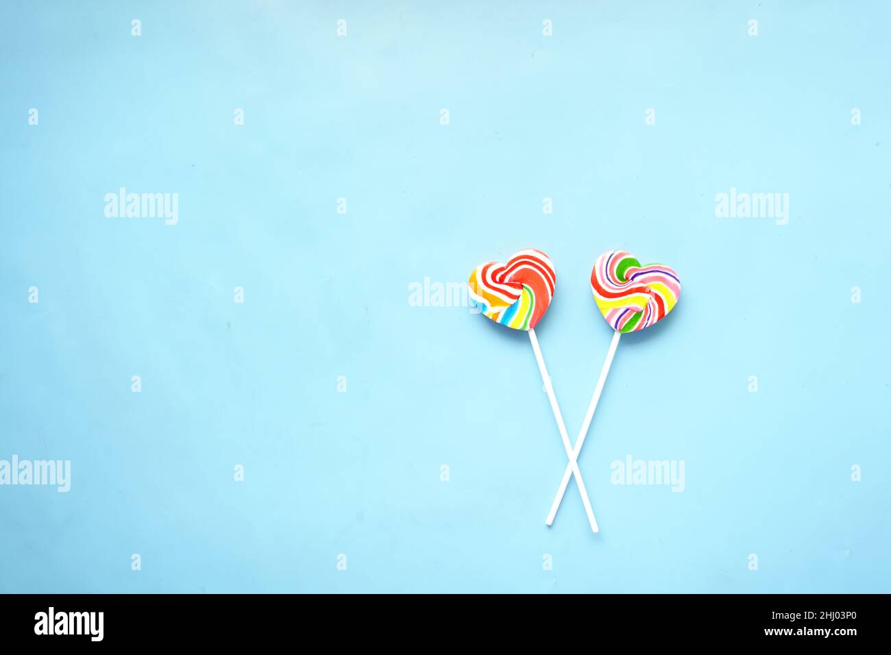 close up of lollipop candy on blue background  Stock Photo