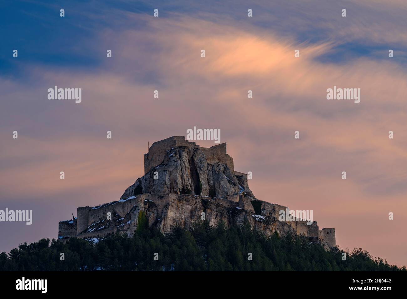 Morella medieval castle in a winter sunset, after a snowfall (Castellón
