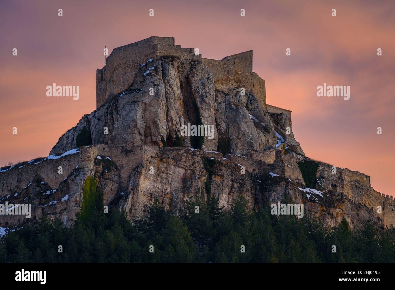 Morella medieval castle in a winter sunset, after a snowfall (Castellón