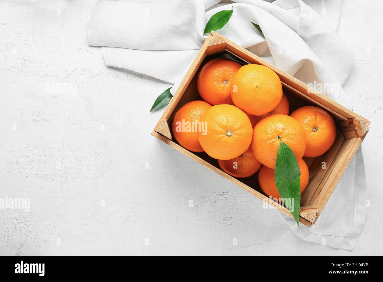 Wooden box with fresh juicy oranges on white background Stock Photo - Alamy