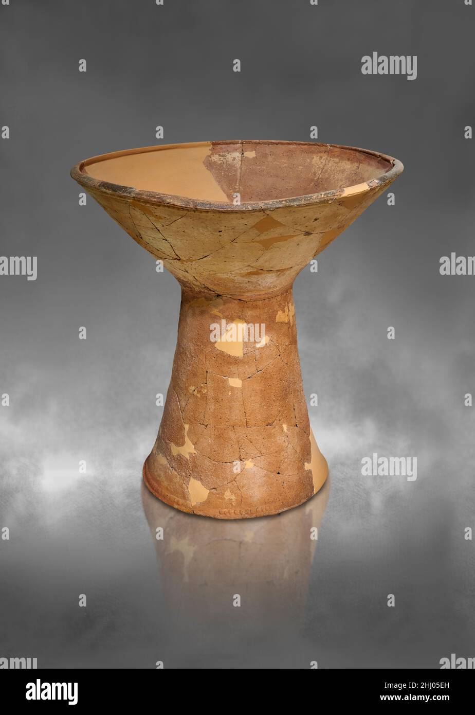Neolithic Greek terracotta pottery friut stand, Tiryns Lower Citadel, 2700-2200 BC. Nafplion Archaeological Museum. Grey art background. Photographer Stock Photo