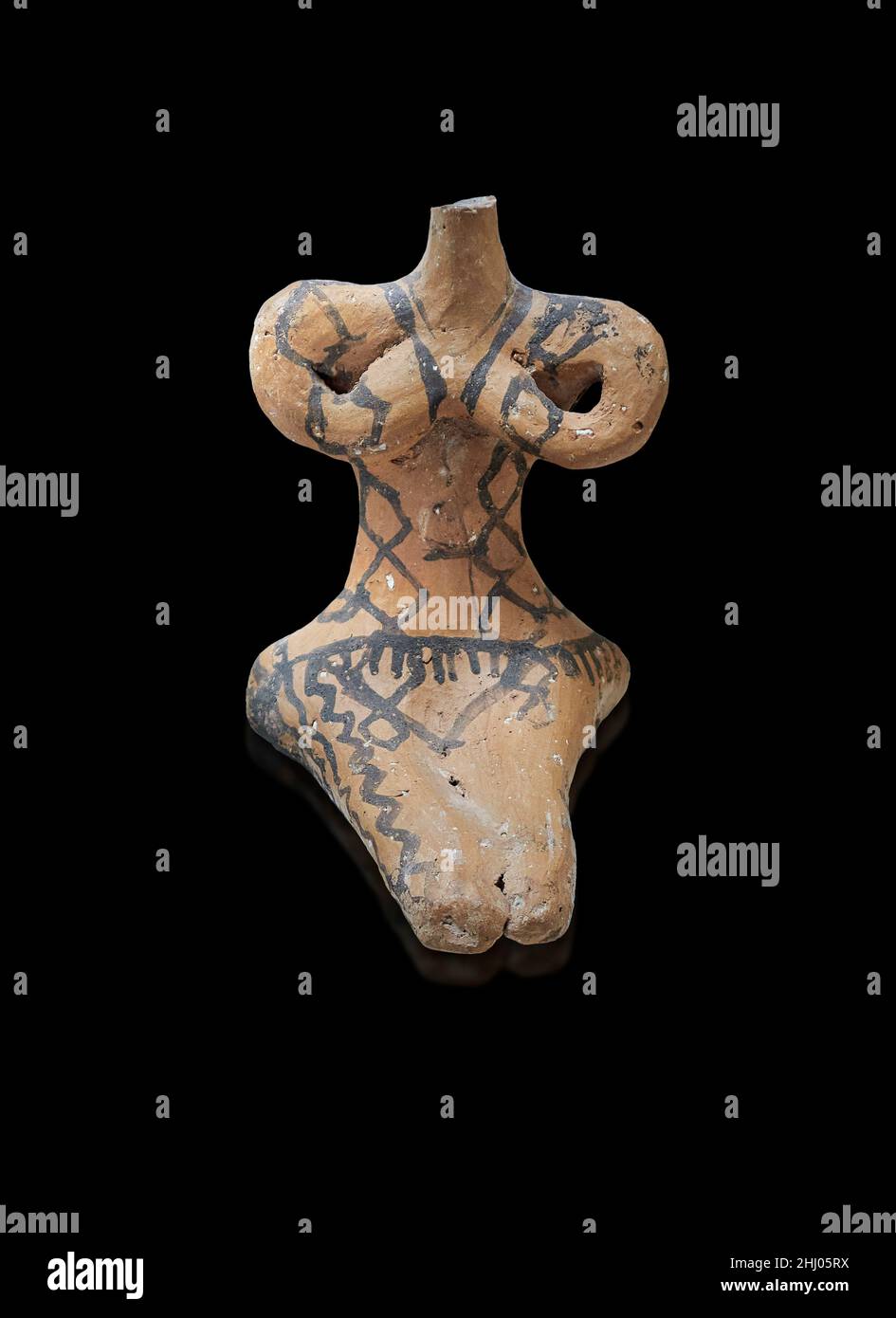 Neolithic Greek pottery female sitting figurine, Franchthi cave, 5300-4500 BC . Nafplio Archaeological Museum. Black background. Photographer Paul E W Stock Photo