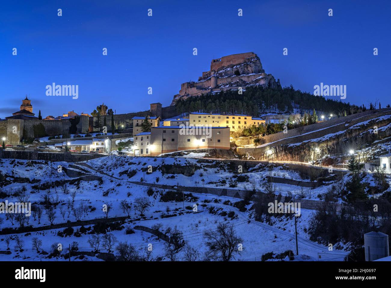 Morella medieval city in a winter blue hour / dawn, after a snowfall (Castellón province, Valencian Community, Spain) ESP: Vista de Morella, Valencia Stock Photo