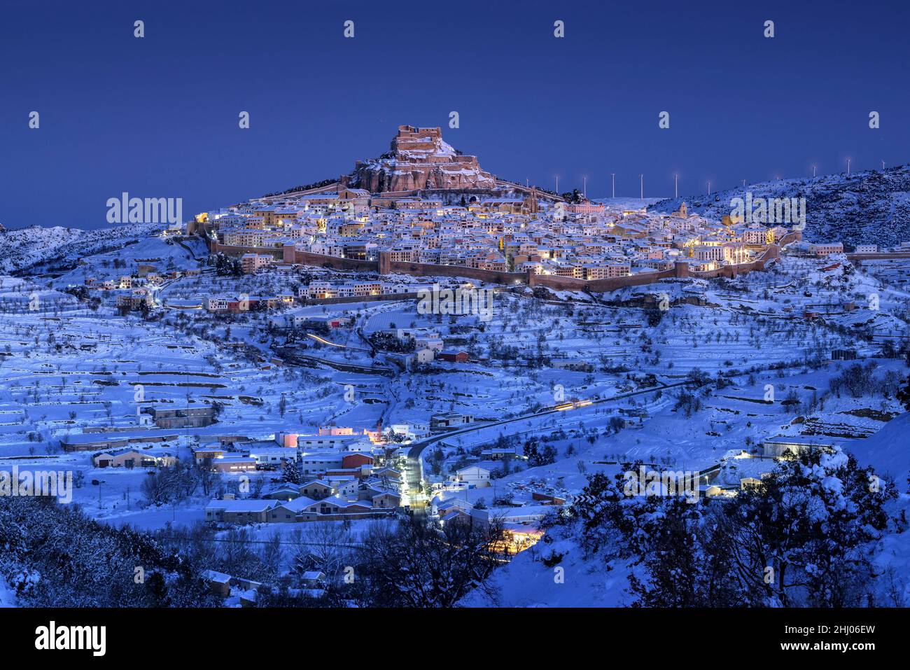 Morella medieval city in a winter blue hour, after a snowfall (Castellón province, Valencian Community, Spain) ESP: Vista de Morella, Valencia, España Stock Photo