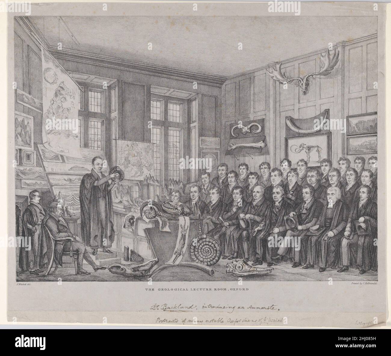 The Geological Lecture Room, Oxford: Dr. William Buckland Lecturing on February 15, 1823 1823–30 Nathaniel Whittock Dr. William Buckland, paleontologist and cleric, appears in this print delivering a lecture at Oxford on February 15, 1823. The interior was located in the Ashmoleon Museum, with specimens hanging on the walls and the lecture illustrated with drawings and prints supported on racks and easels. That same year Buckland resigned his college fellowship to become Canon of Christ Church, but continued to give his annual course of lectures on geology and minerology. To accomodate the gro Stock Photo