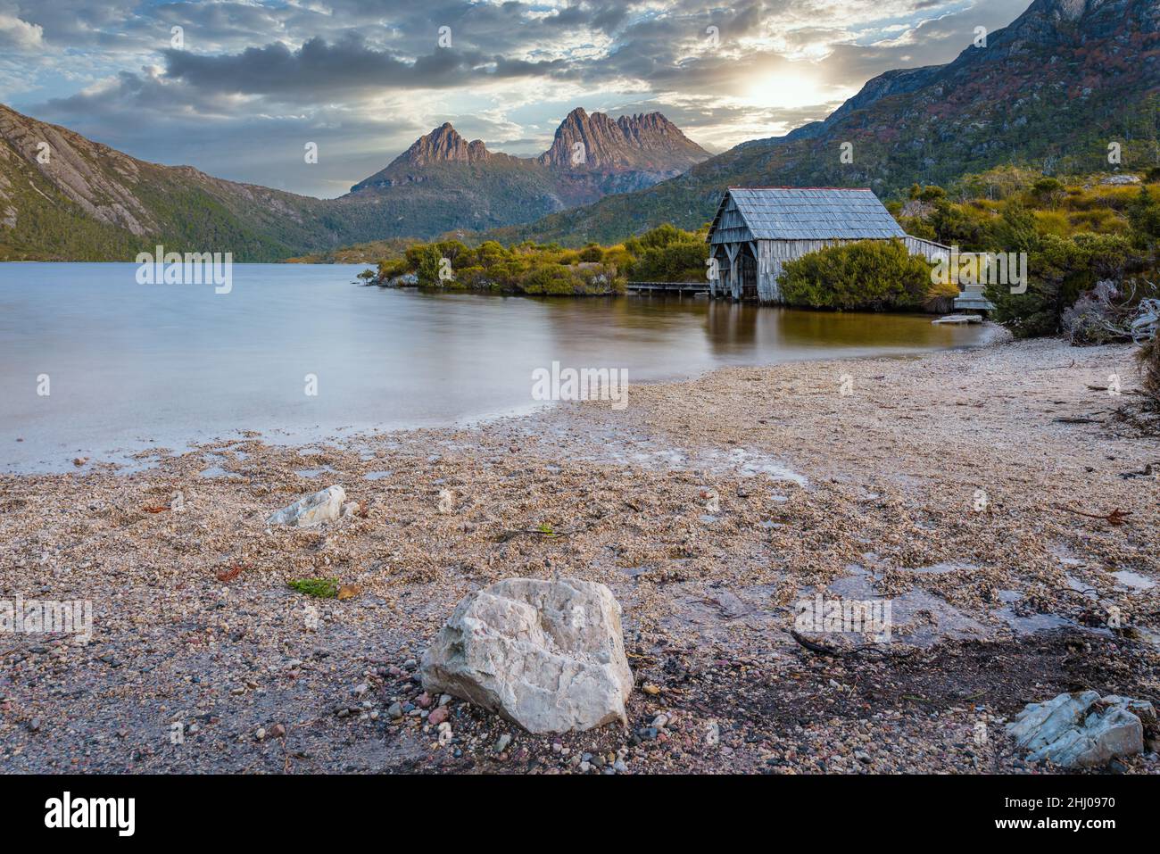 Iconic view of Dove Lake and sandy foreshore and the wooden boathouse in the Cradle Mountain National Park in Tasmania, Australia. Stock Photo