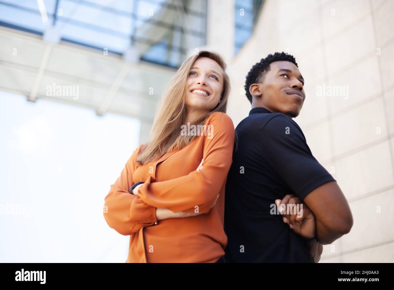 successful business couple standing in front of office center Stock ...