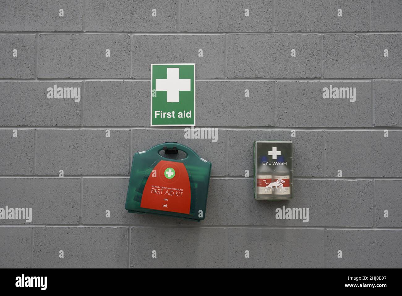Industrial first aid station on a wall. With copy space. Stock Photo