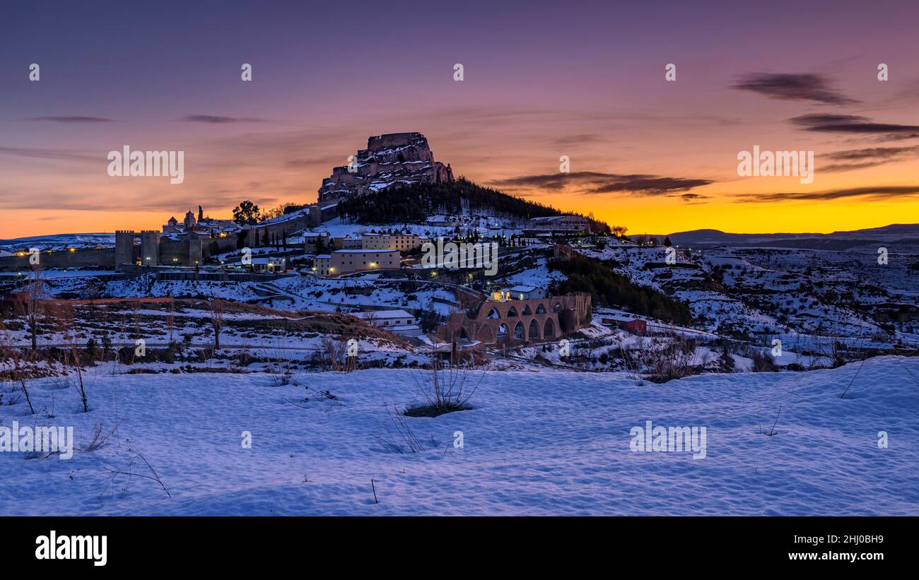 Morella medieval city in a winter twilight and night, after a snowfall (Castellón province, Valencian Community, Spain) ESP Morella en invierno España Stock Photo