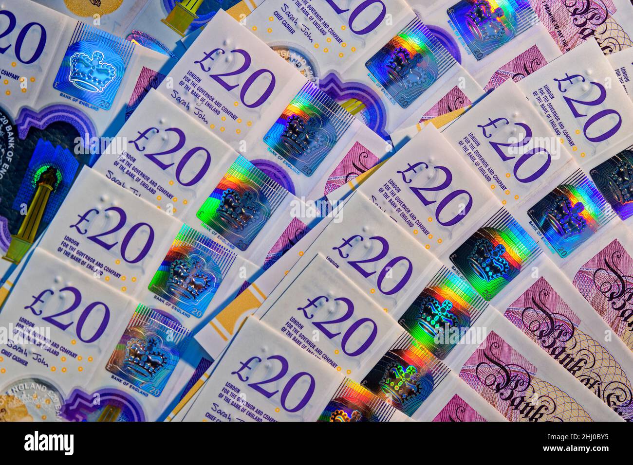 Twenty Pounds Sterling notes showing security hologram printing features. Stock Photo