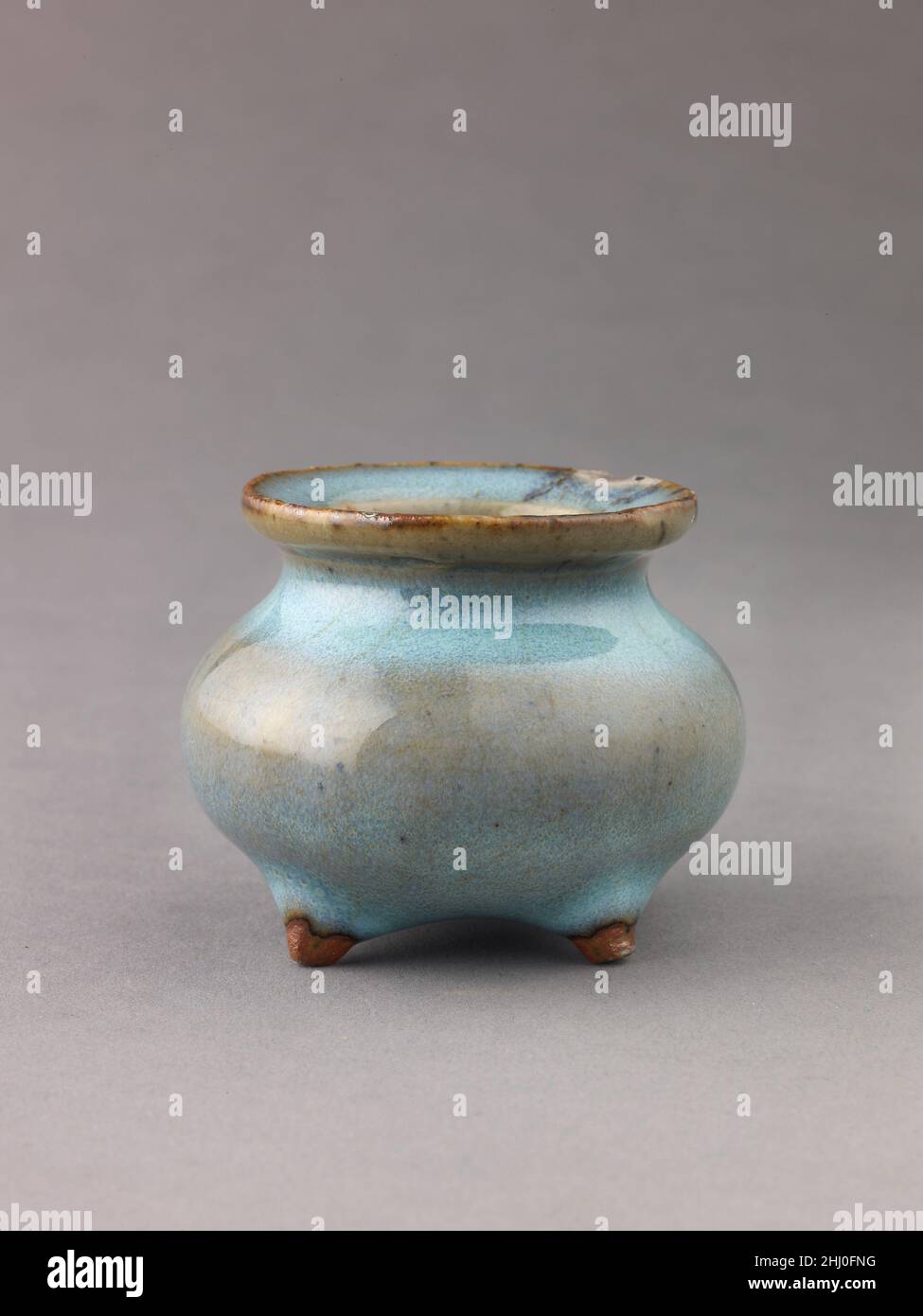 Miniature incense burner, Jun ware 13th–14th century Chinese. Miniature incense burner, Jun ware. Chinese , Jin/Yuan Dynasty. Chinese. 13th–14th century. Stoneware with blue glaze.. Ceramics Stock Photo