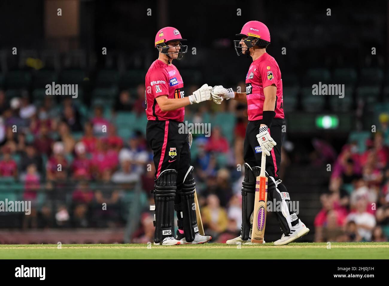 Sydney, Australia, 26 January, 2022. Hayden Kerr of the Sixers and Sean Abbott of the Sixers touch gloves during the Big Bash League Challenger cricket match between Sydney Sixers and Adelaide Strikers at The Sydney Cricket Ground on January 26, 2022 in Sydney, Australia. Credit: Steven Markham/Speed Media/Alamy Live News Stock Photo