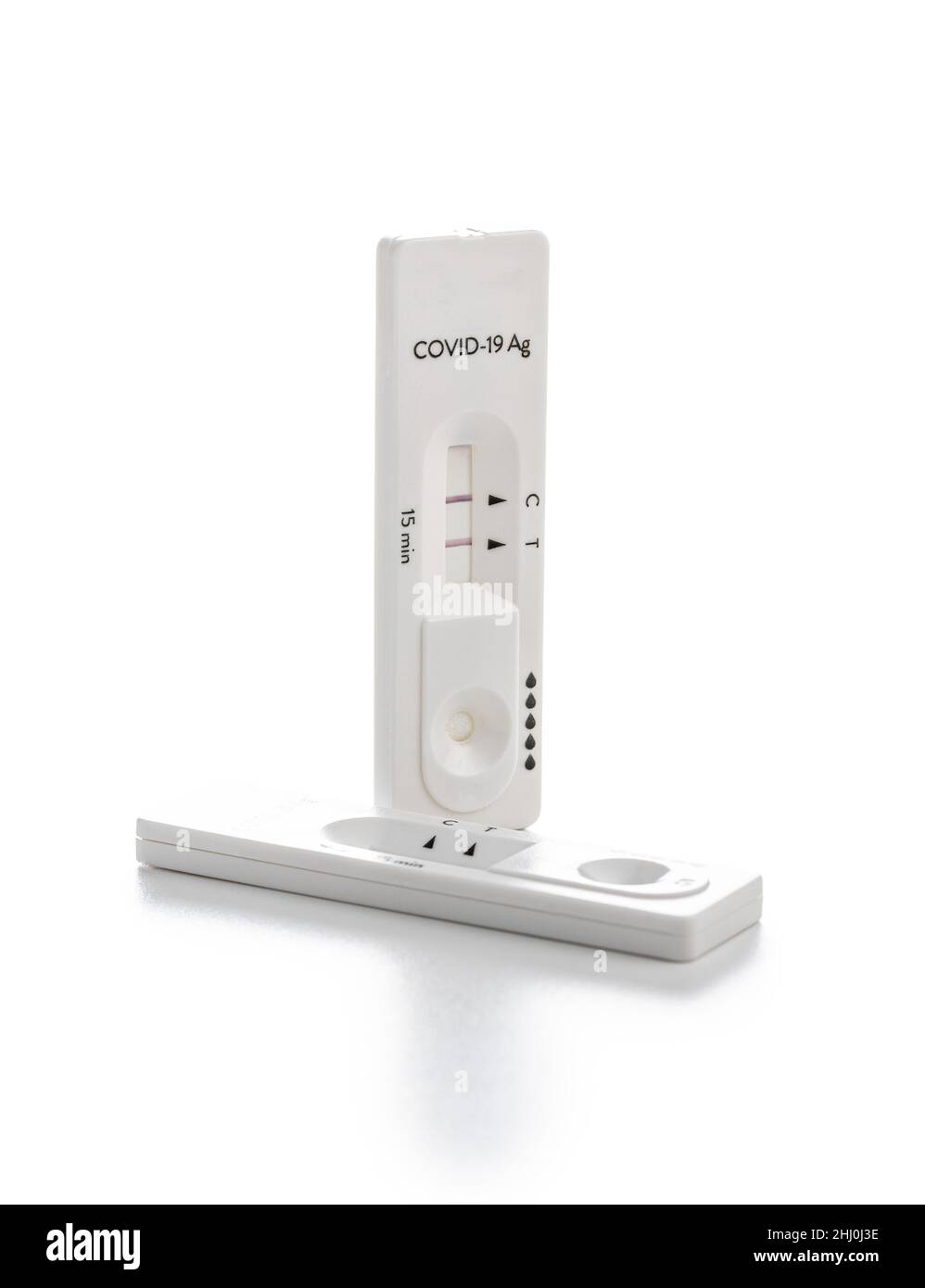 Positive Covid-19 antigen test. Coronavirus antigen rapid test isolated on white background. Stock Photo