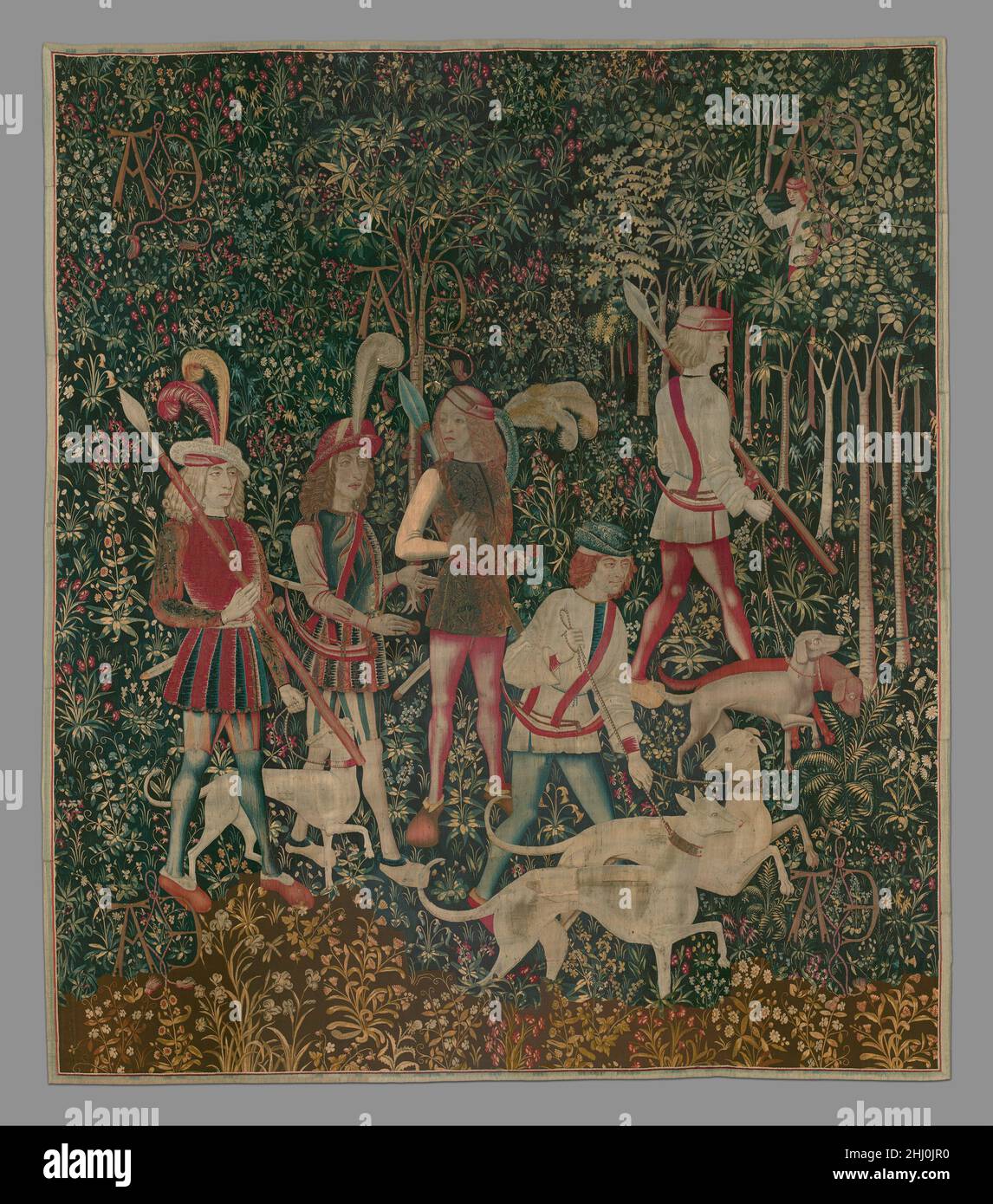 The Hunters Enter the Woods (from the Unicorn Tapestries) 1495–1505 French (cartoon)/South Netherlandish (woven) This tapestry is one of seven hangings at The Cloisters that depict the hunt of the unicorn, a mythical creature first mentioned by the Greek physician Ctesias in the fourth century B.C. In the Middle Ages the animal was best known for its supposed invincibility and for the therapeutic property of its horn. So strong was the belief in the horn's miraculous cures that by the twelfth century the tusks of male narwhals, a small whale native to the Arctic, came to be regarded as 'unicor Stock Photo