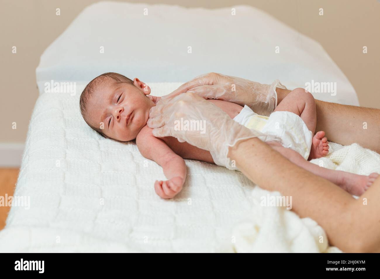Physiotherapist performing a clavicle and first rib assessment on a ...