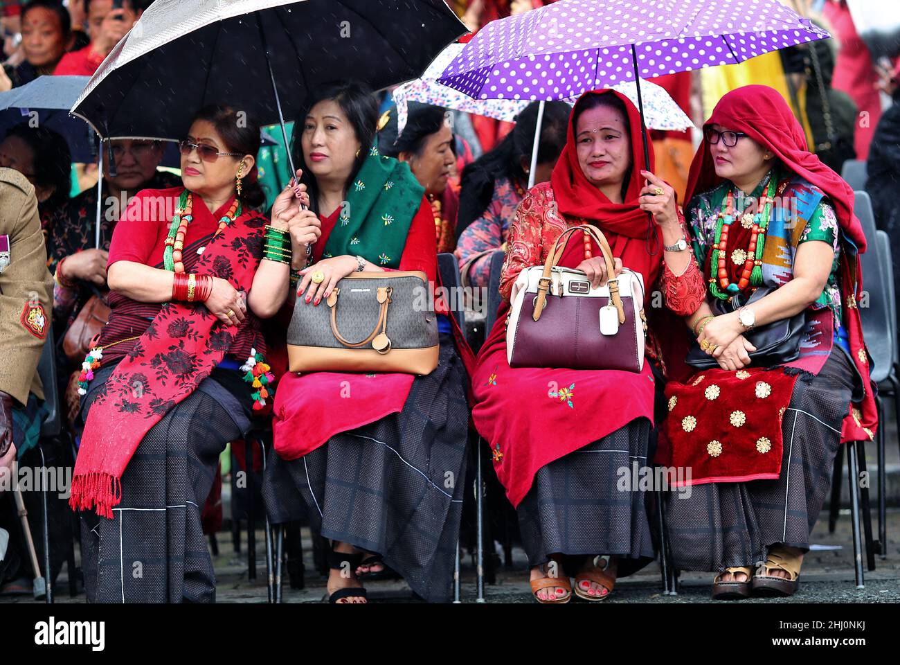 Brecon, Powys, Wales, Gurkha Freedom Parade on the 9th of June 2019. Gurkha soldier families take cover from the rain, on the Bulwark in Brecon Town c Stock Photo