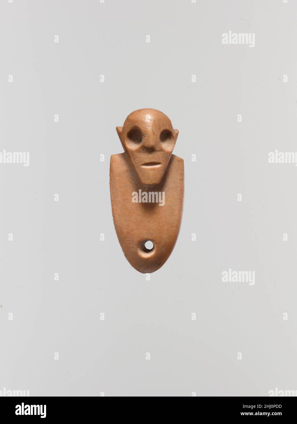 Amuletic figure ca. 3650–3300 B.C. Predynastic, Naqada II. Amuletic figure. ca. 3650–3300 B.C.. Limestone (pink). Predynastic, Naqada II. From Egypt Stock Photo