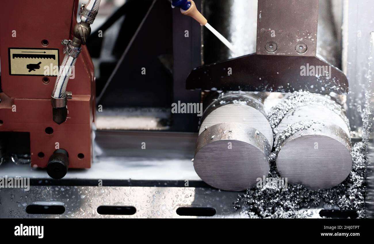 Band saw machine cutting steel rod in Industrial metalwork