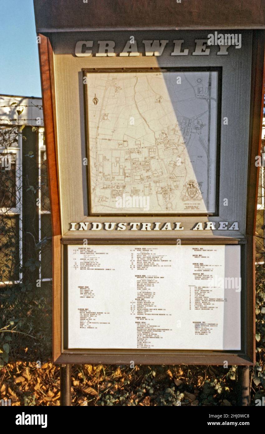 A sign with a map and listing of business addresses of the Industrial Area of Crawley ‘New Town’, West Sussex, England, UK in 1969. The commercial and industrial zone was mainly concentrated to the north of the town centre around Fleming Way, Gatwick Road and Manor Royal. It was developed to create jobs in the post-war ‘new town’. The area has undergone massive changes and modernisation since this period. This image is from an old amateur Kodak colour transparency – a vintage 1960s photograph. Stock Photo