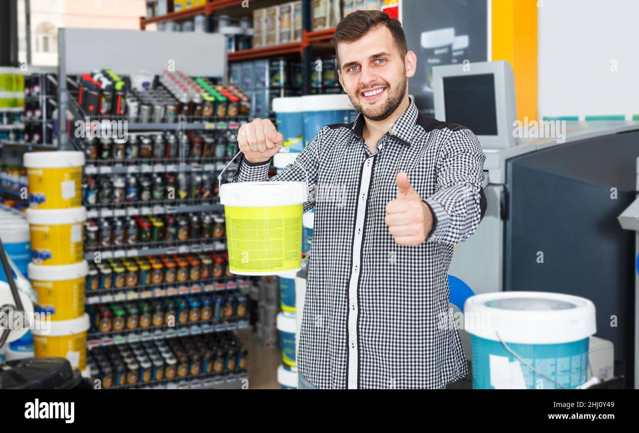 Man customer holding paint hi-res stock photography and images - Alamy