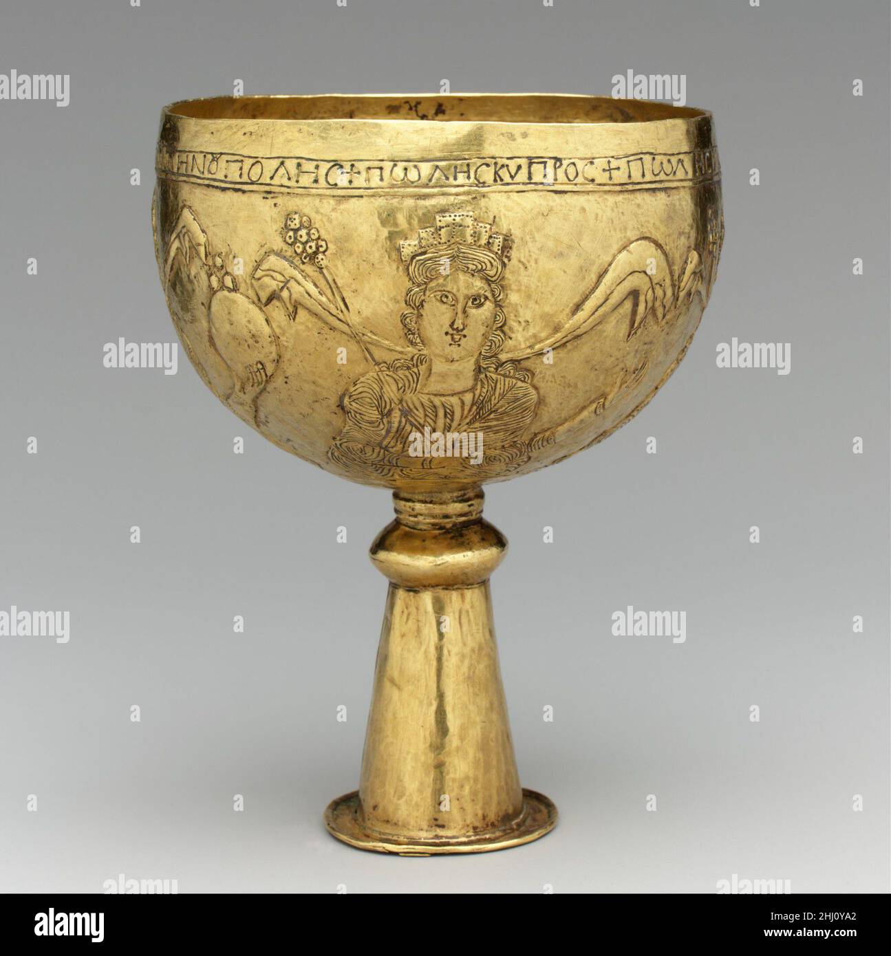 Gold Goblet with Personifications of Cyprus, Rome, Constantinople, and Alexandria 700s Avar or Byzantine This goblet is decorated with female personifications of four major ecclesiastical centers in the Byzantine world. The awkwardly written identifications suggest that this goblet was an Avar attempt to imitate a Byzantine chalice.The AvarsThe Avars were a nomadic tribe of mounted warriors from the Eurasian steppe. The Byzantine emperor Justinian negotiated with them in the sixth century to protect the Empire’s northern border along the Black Sea. Emboldened by their subjugation of numerous t Stock Photo