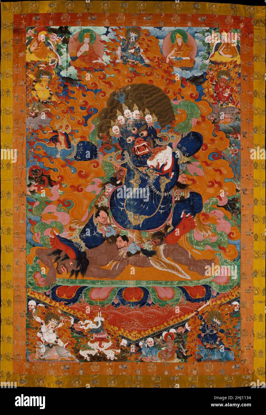 Yamantaka, Destroyer of the God of Death early 18th century Tibet This image of a wrathful protector of Buddhism would have been an awesome presence in the dimly lit interior of a Tibetan monastery. Yamantaka is a violent aspect of the Bodhisattva Manjushri, who assumes this form to vanquish Yama, the god of death. By defeating Yama, the cycle of rebirths (samsara) that prevents enlightenment is broken. Yamantaka, who shares many attributes with Mahakala, is identified by his blue skin and the array of attributes displayed here. He is encircled by five smaller manifestations, each a Yama-conqu Stock Photo