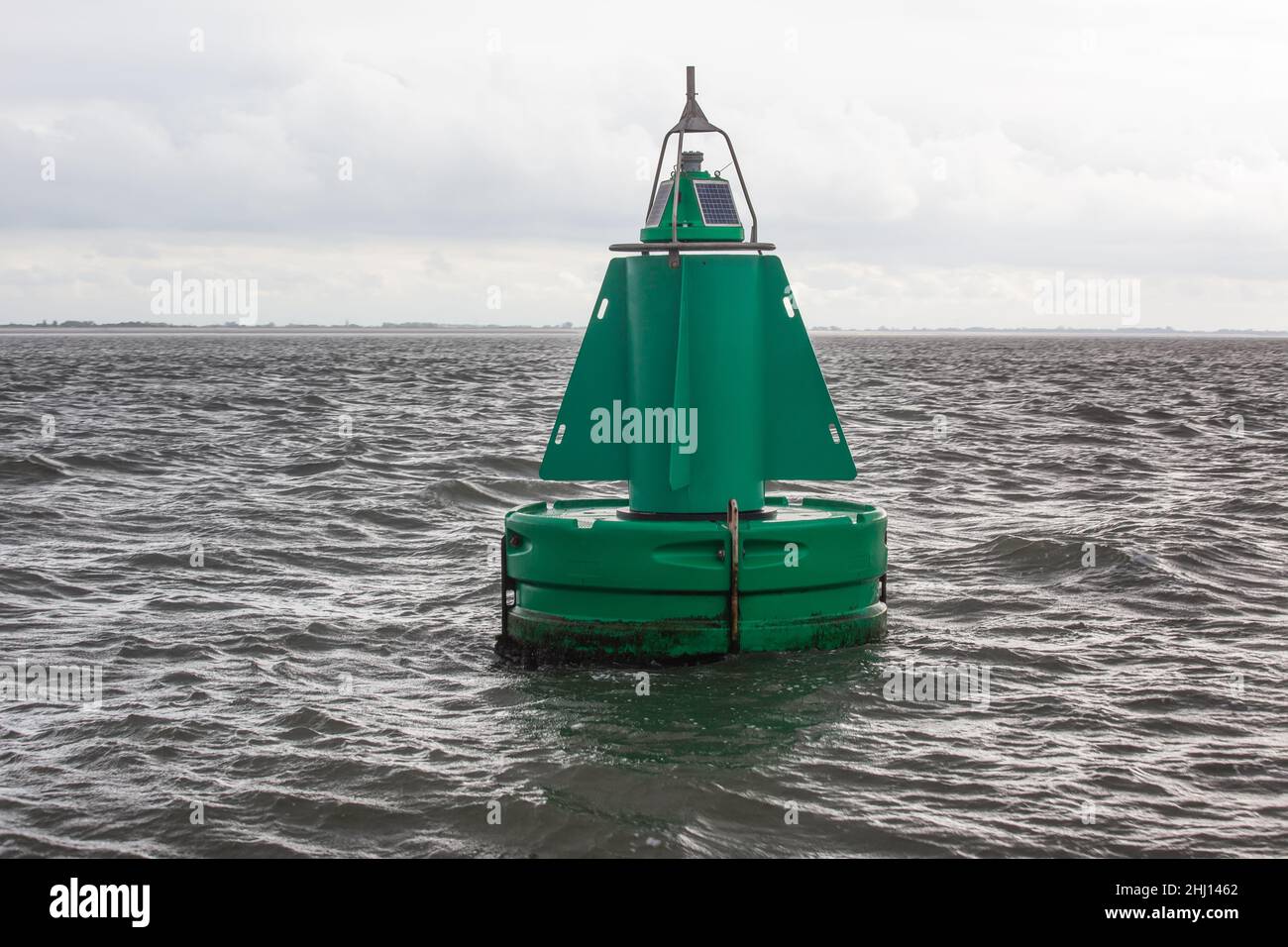 A green channel marker buoy in the water Stock Photo Alamy