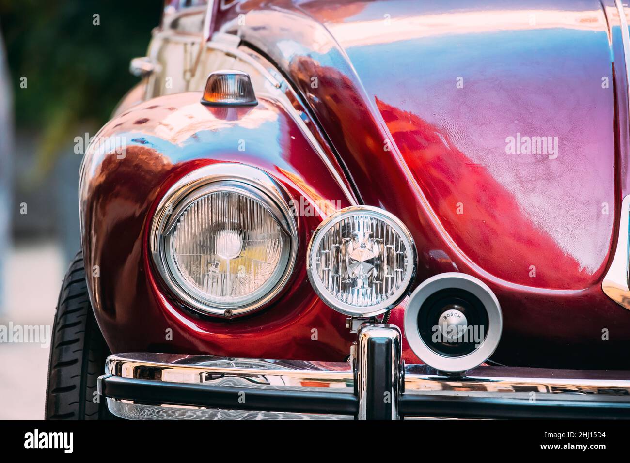 Rome, Italy. Close Up Headlight Of Old Retro Vintage Red Color Volkswagen Beetle Car Parked At Street Stock Photo