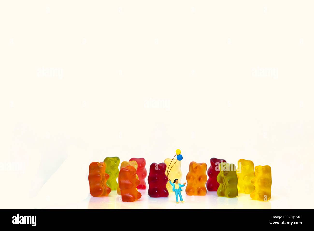 Children, child are happy in front of colorful sweet wine gummy bears Stock Photo
