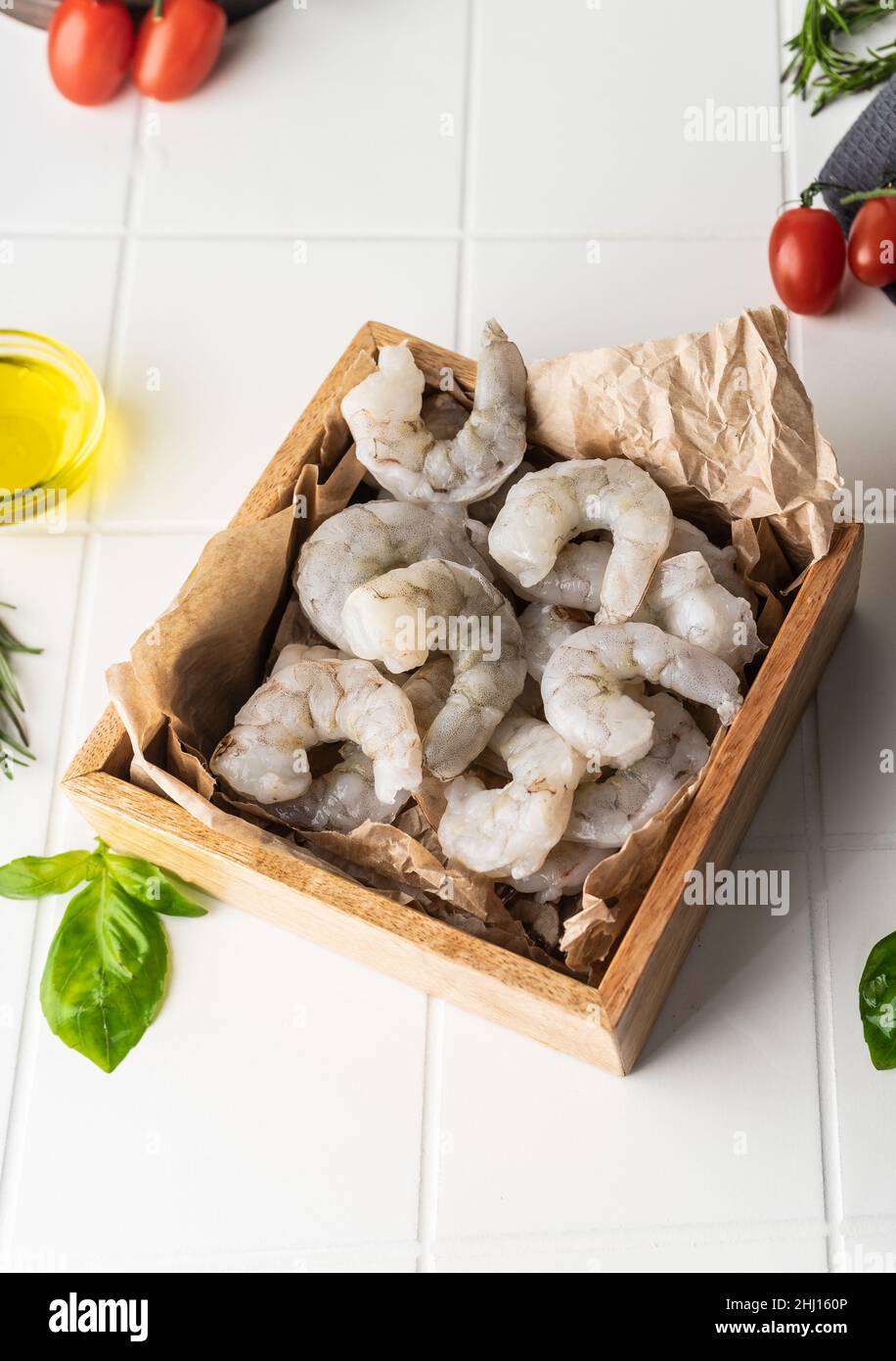 Thawed peeled shrimp, seafood, delicacy. on a white background, in a ...