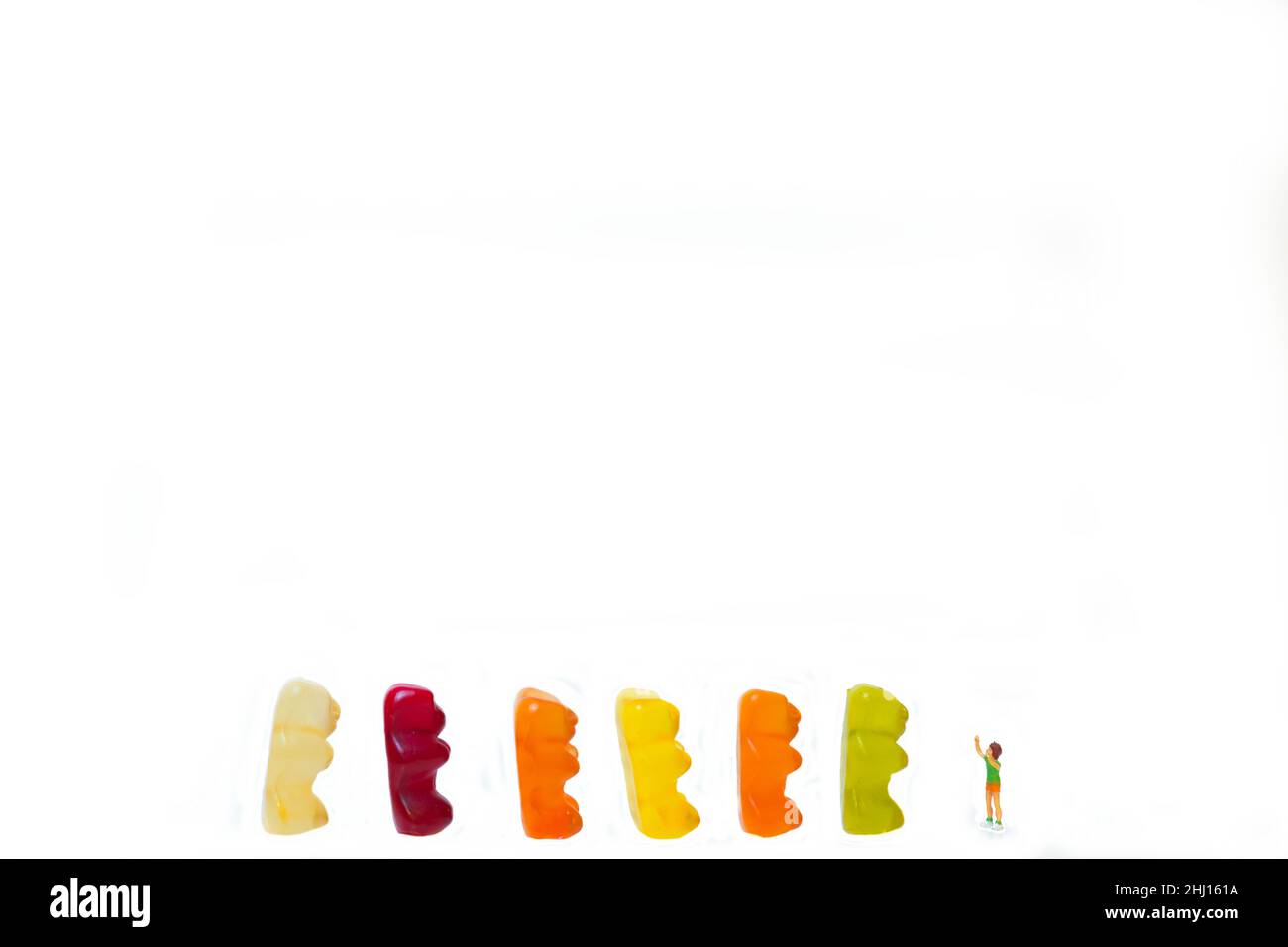 Children, child are happy in front of colorful sweet wine gummy bears Stock Photo