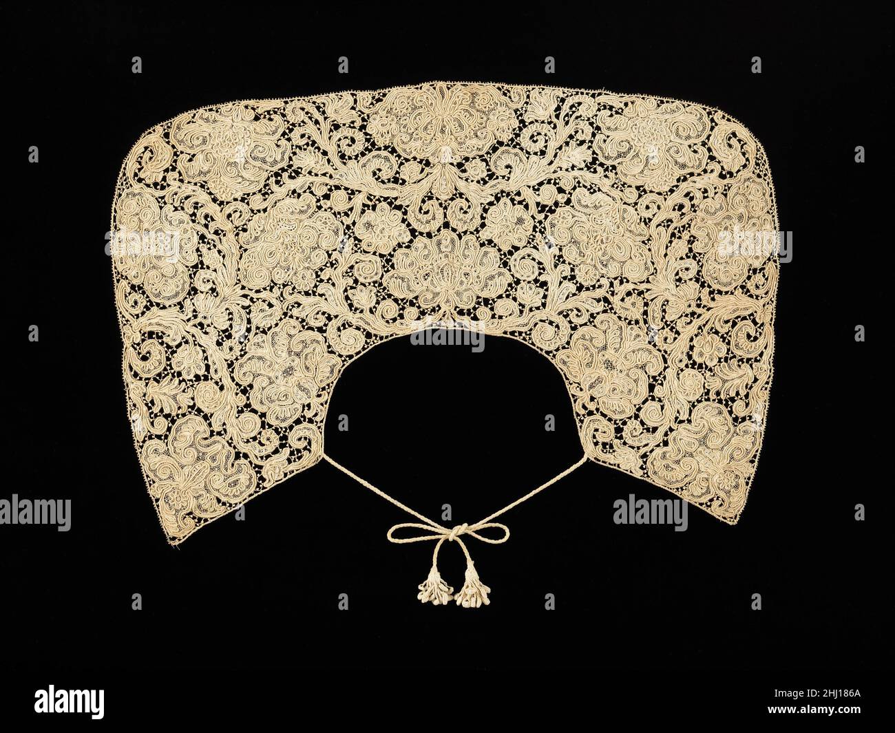 Collar late 17th century Spanish As it was customary to refashion fine laces, early lace pieces in their original form are fairly rare. That the lace pattern fills the whole space and conforms to the shape of the piece indicates this collar is in its original form. The ties are later replacements for the original ones.. Collar  156386 Stock Photo