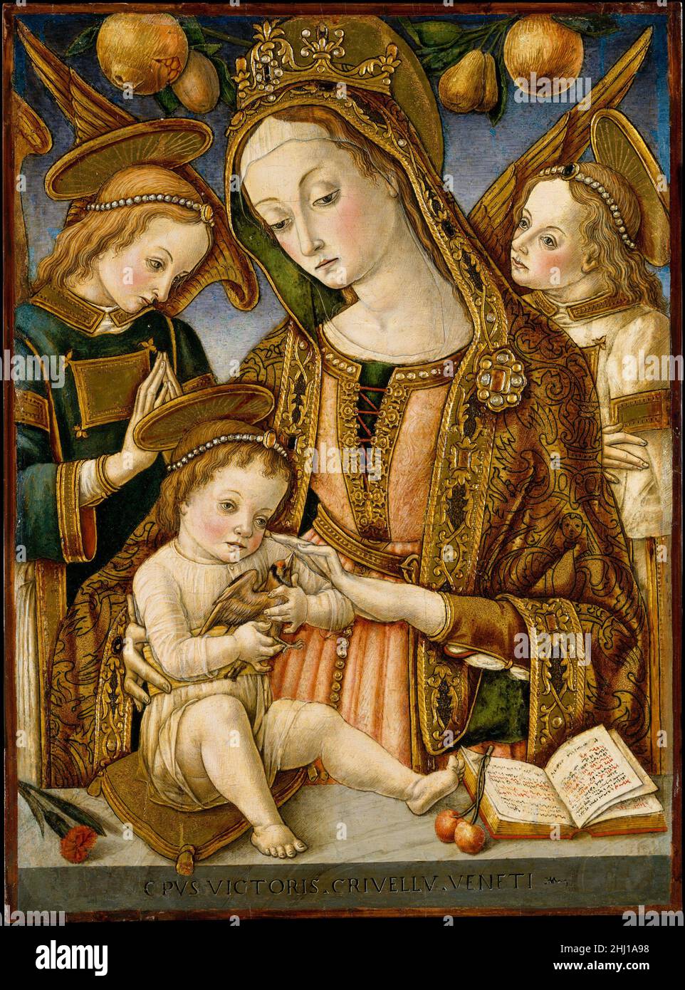 Madonna and Child with Two Angels ca. 1481–82 Vittore Crivelli Italian This charming Madonna and Child employs some of the same pictorial devices used by Vittore's brother Carlo, building up the gold to create three-dimensional embellishments. The parapet is inscribed with Vittore's name and on it are placed a carnation (emblem of love), cherries (like the apple, symbol of original sin), and a devotional book. The Child holds a goldfinch, symbolic of the Passion of Jesus.. Madonna and Child with Two Angels  436056 Stock Photo