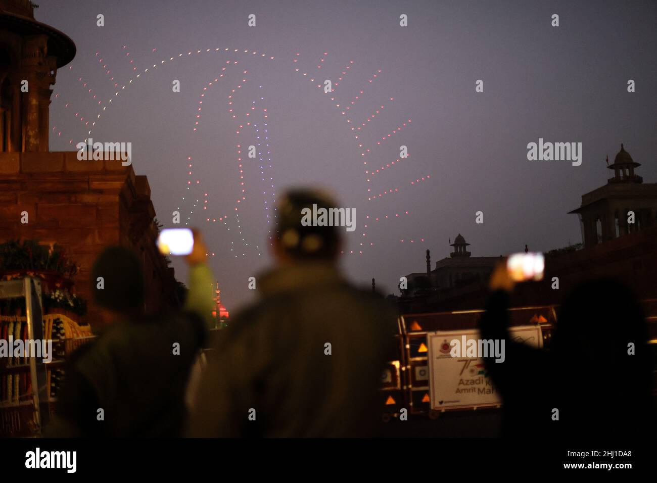 New Delhi, New Delhi, India. 26th Jan, 2022. People take photographs of drones flying in a formation at Raisina hill during rehearsals for the Beating Retreat ceremony. (Credit Image: © Karma Sonam Bhutia/ZUMA Press Wire) Stock Photo