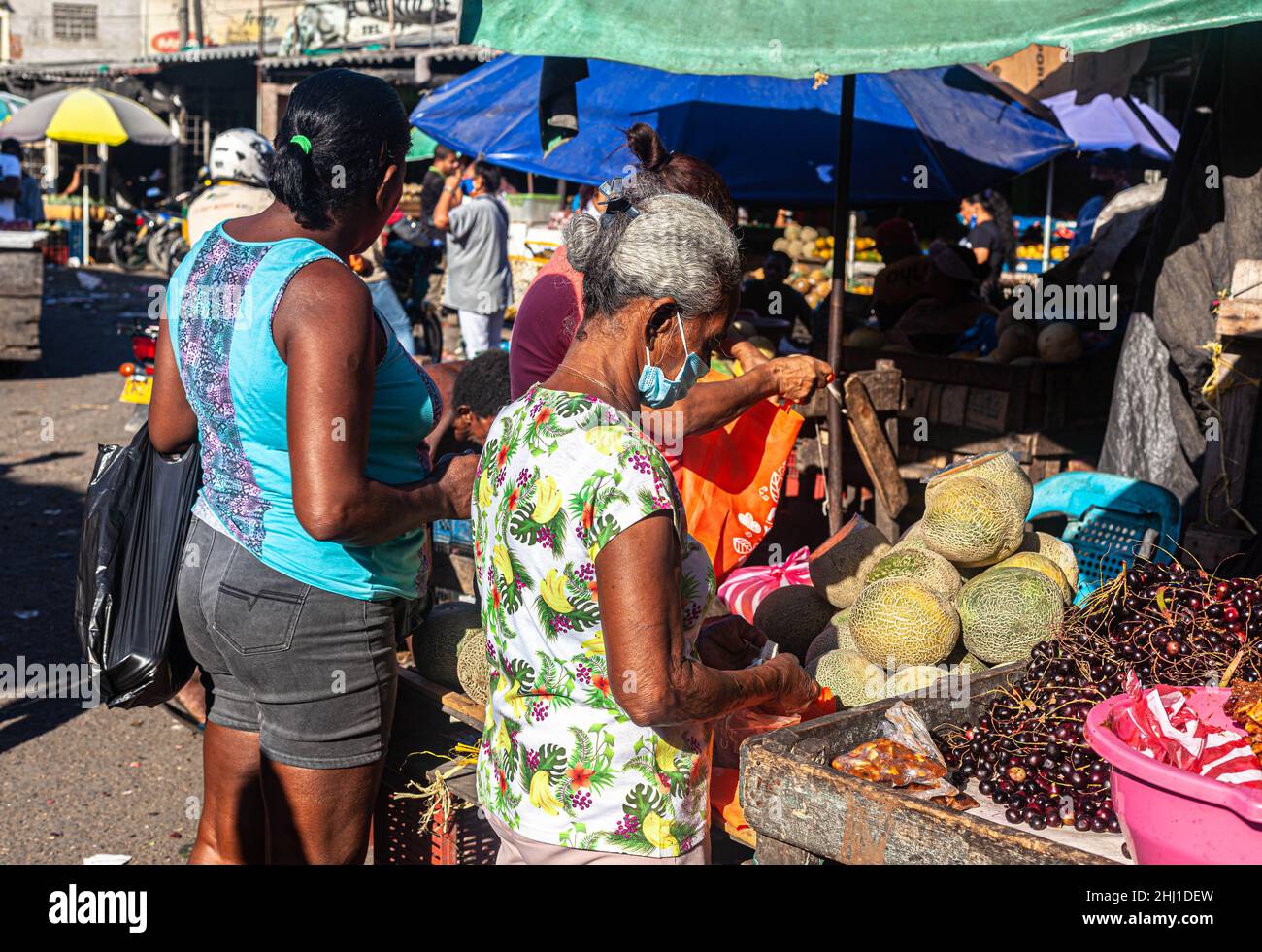 Daily activity at a tropical fruit stall, Mercado Bazurto, Cartagena de Indias, Colombia. Stock Photo