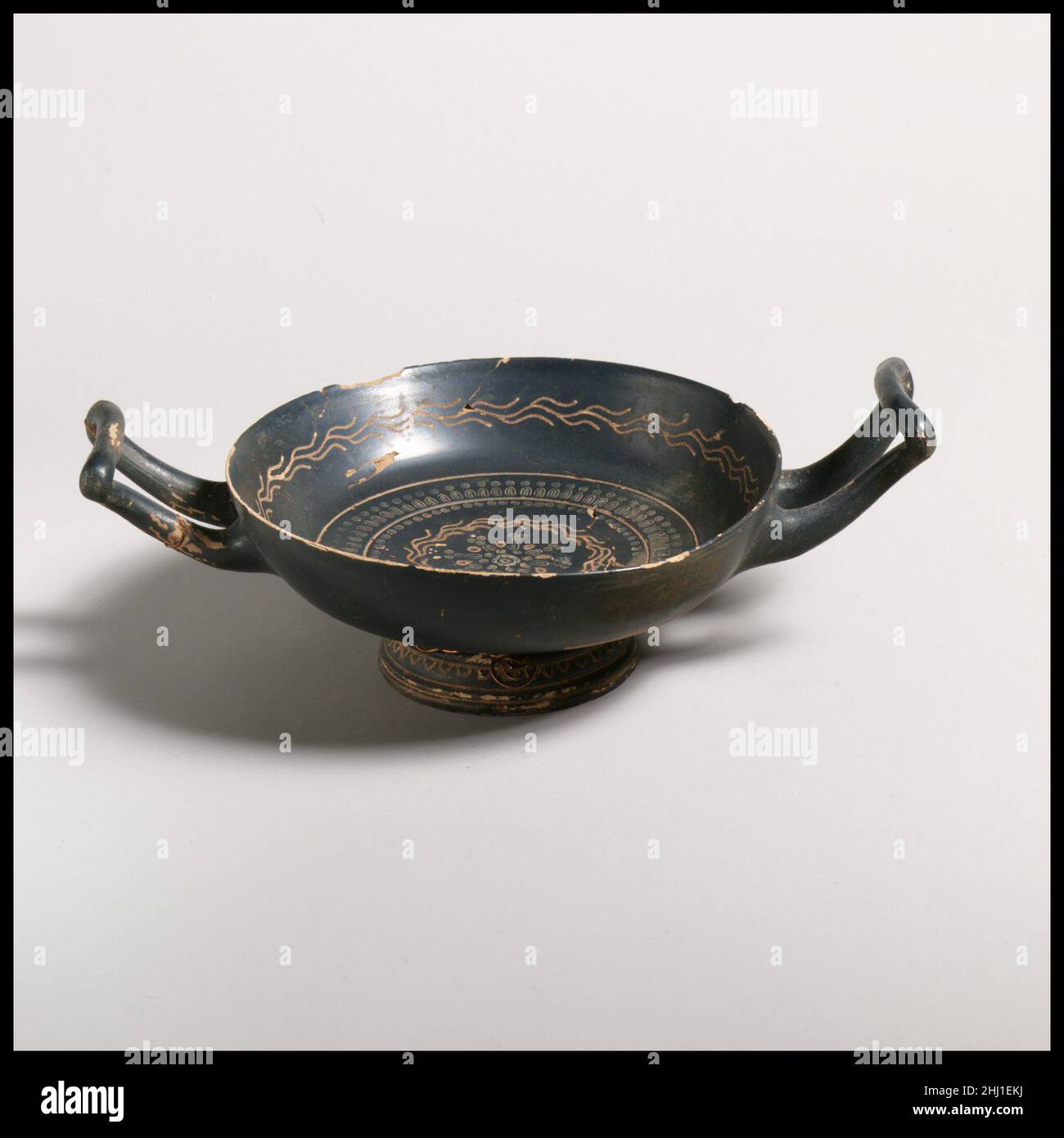 Terracotta kylix (drinking cup) ca. 330–300 B.C. Greek, South Italian, Campanian, Teano Decorated with ivy vine and stamped pattern.. Terracotta kylix (drinking cup)  248195 Stock Photo