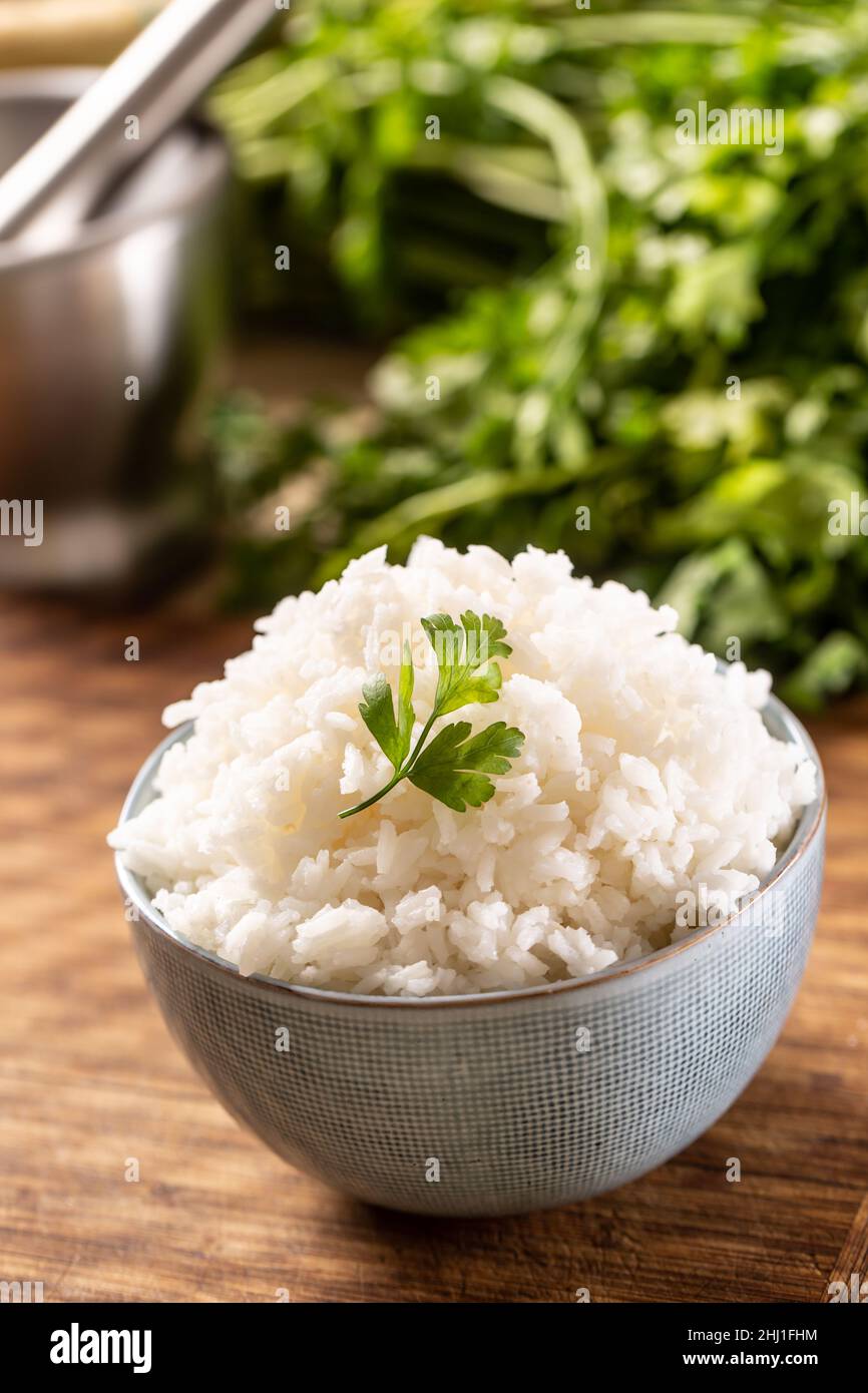 Fresh Cooked Rice Cooked rice in a bowl with fresh parsley Stock Photo - Alamy