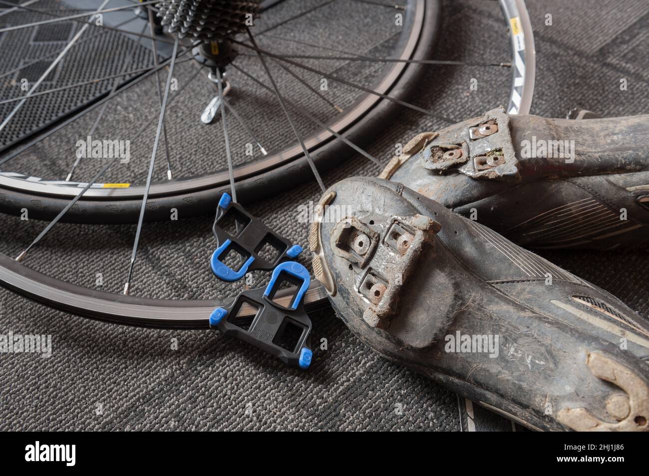 Worn cycling cleats to be replaced when it becomes difficult to release rider from the pedal possible cause of accident dangerous injury Stock Photo