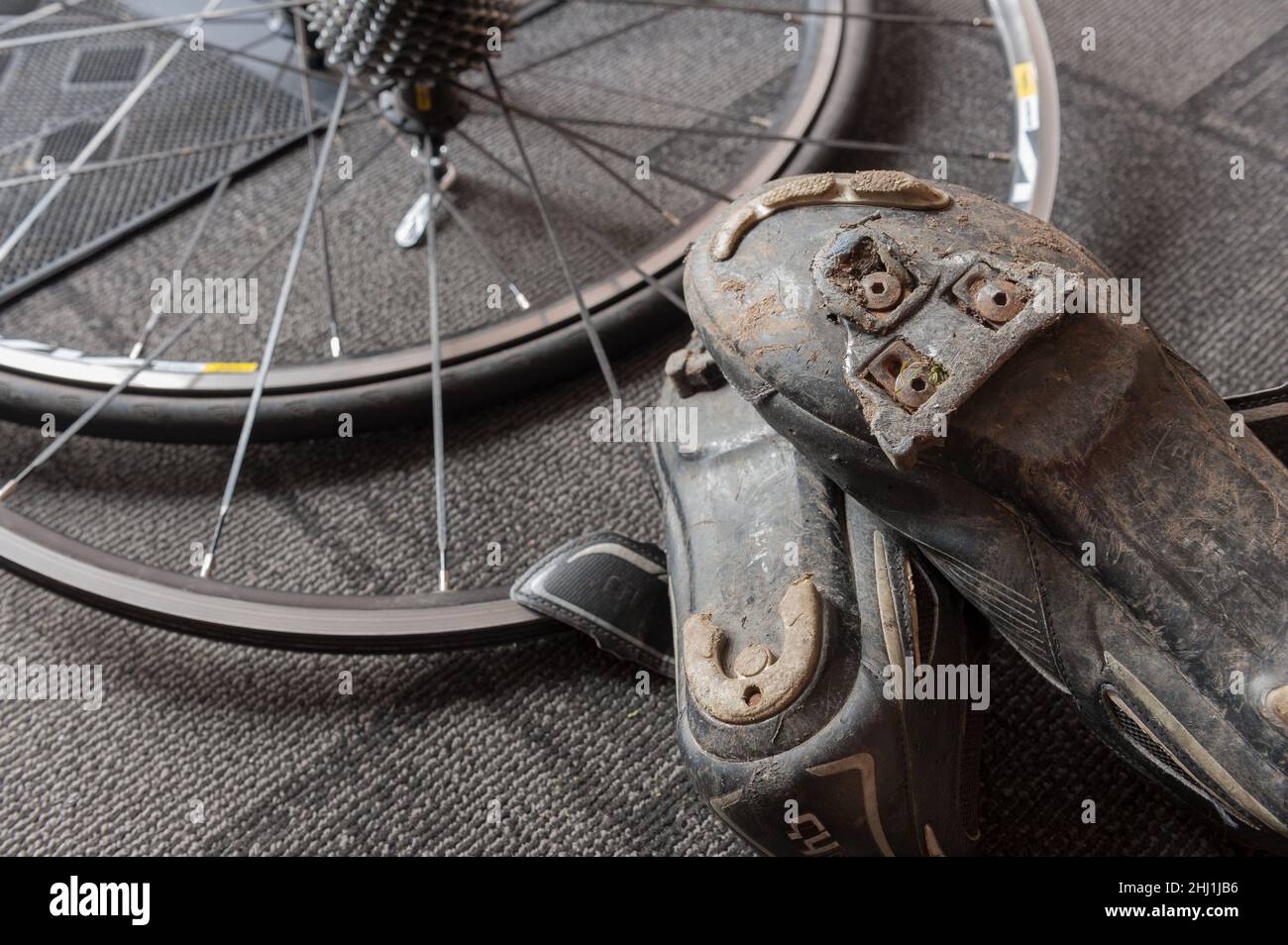 Worn cycling cleats to be replaced when it becomes difficult to release rider from the pedal possible cause of accident dangerous injury Stock Photo