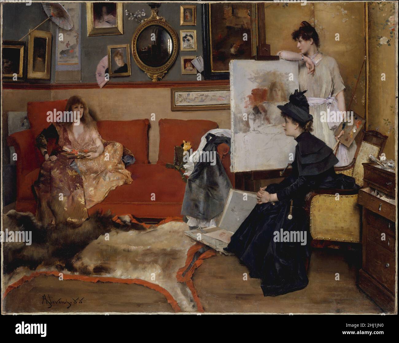 In the Studio 1888 Alfred Stevens Belgian The beautiful sitters, art along the walls, open portfolio, and prominent mirror symbolize the artistic practice of Stevens, who was celebrated for his portrayals of chic and charming women. On the easel is his painting of the biblical temptress Salomé (Musées Royaux des Beaux-Arts de Belgique, Brussels). The female protagonists of In the Studio pose a counterpoint to the male-dominated French art world, which presented many barriers to women artists, and particularly those undertaking ambitious figural subjects. Stevens encouraged the careers of a num Stock Photo