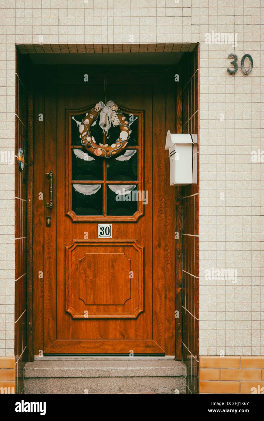 Beautiful wooden door with a wreath Stock Photo