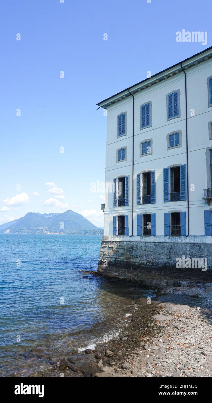 Large Italian-style building on the shores of the blue sea Stock Photo