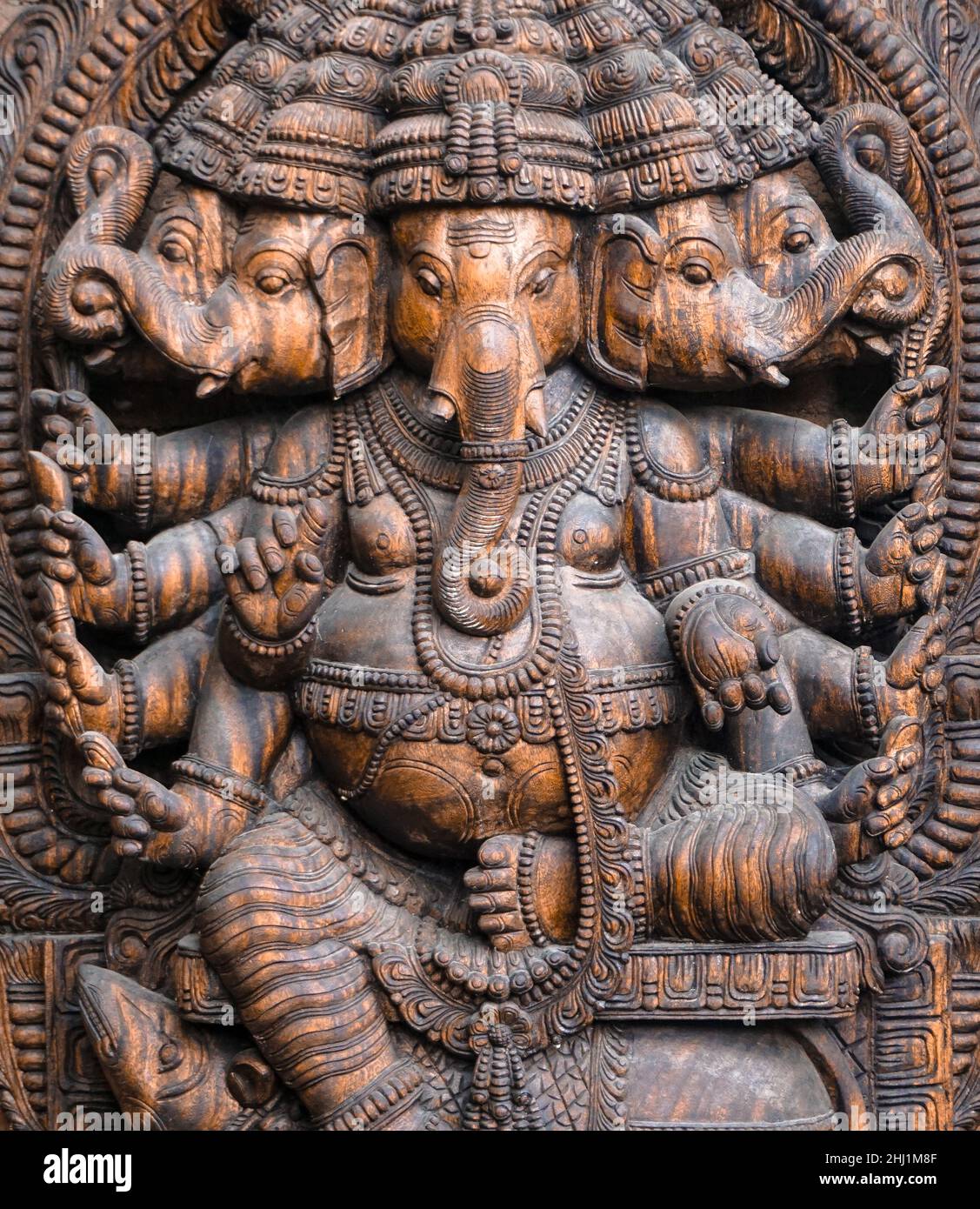 A wooden statue of the Indian god 'Ganesha', the elephant-headed god Stock Photo
