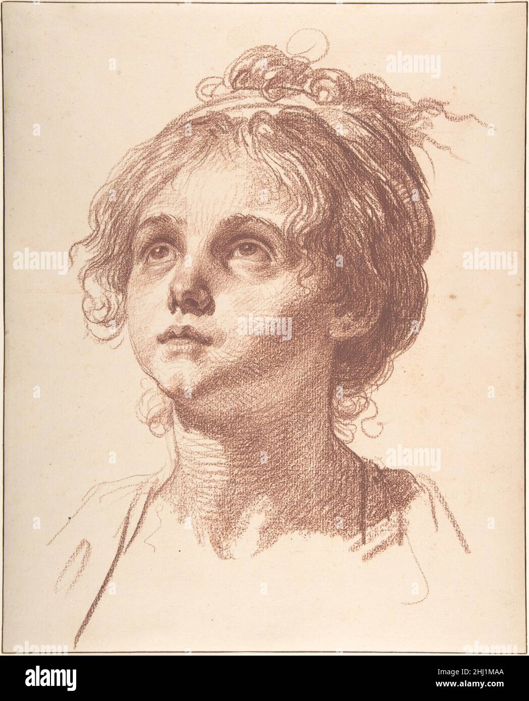 Head of a Girl Looking Up n.d. Jean-Baptiste Greuze French Published in 1762, the treatise Emile, or On Education by the philosopher Jean-Jacques Rousseau (1712–1778) transformed educational theory and shaped a new image of childhood defined by innocence and virtue. This theme was quickly taken up by artists such as the sculptor Jean Antoine Houdon, the portraitist Elisabeth Louise Vigée Le Brun, and the genre painter Jean-Baptiste Greuze. Further inspired by the philosopher Denis Diderot, who also believed that education was an important tool to moralize society, Greuze depicted several scene Stock Photo
