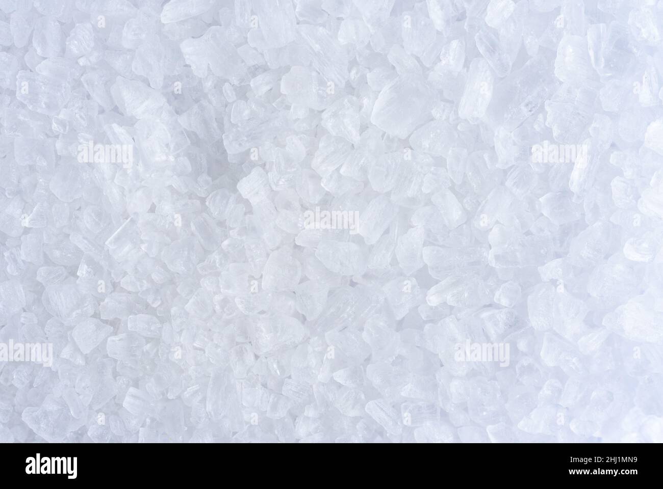 White background of rock salt, macro Stock Photo