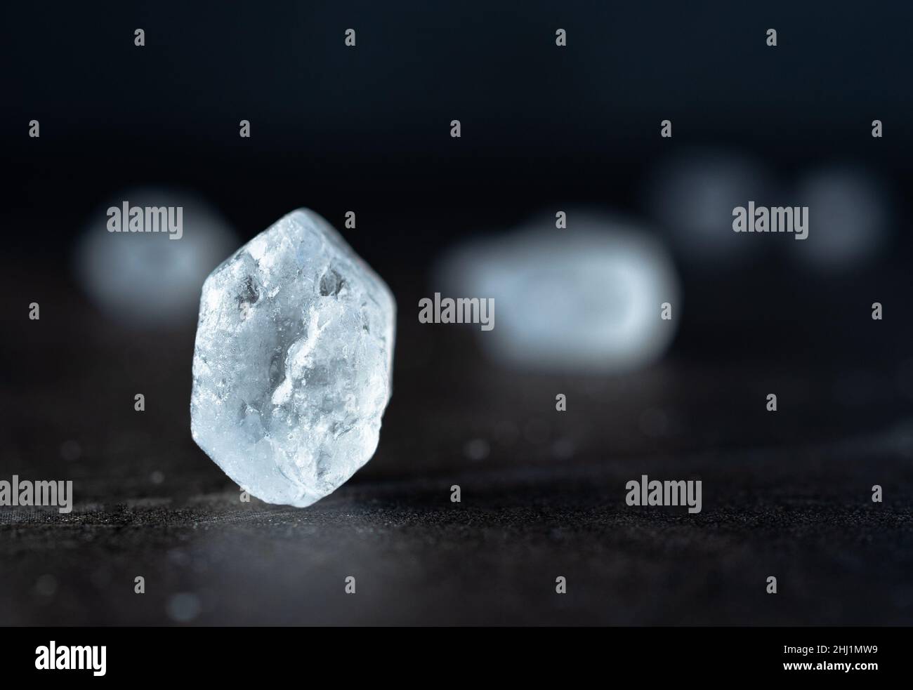 Beautiful rock candy crystal against the dark background Stock Photo